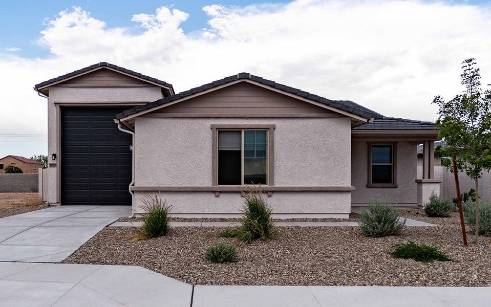 Front exterior of a new home in Rancho Mirage, Maricopa, AZ, highlighting curb appeal (Image 2). Front exterior of a new home in Rancho Mirage, Maricopa, AZ, highlighting curb appeal (Image 2).