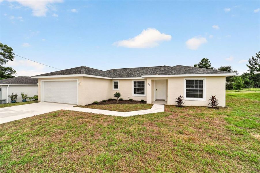 Front exterior of a new home in , Ocala, FL, highlighting curb appeal (Image 15).