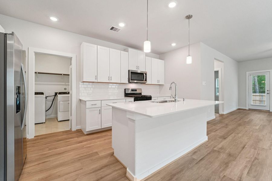 Furnished interior view inside a new home in Landing Meadows - Traditional Series, New Caney (Image 8). Furnished interior view inside a new home in Landing Meadows - Traditional Series, New Caney (Image 8).