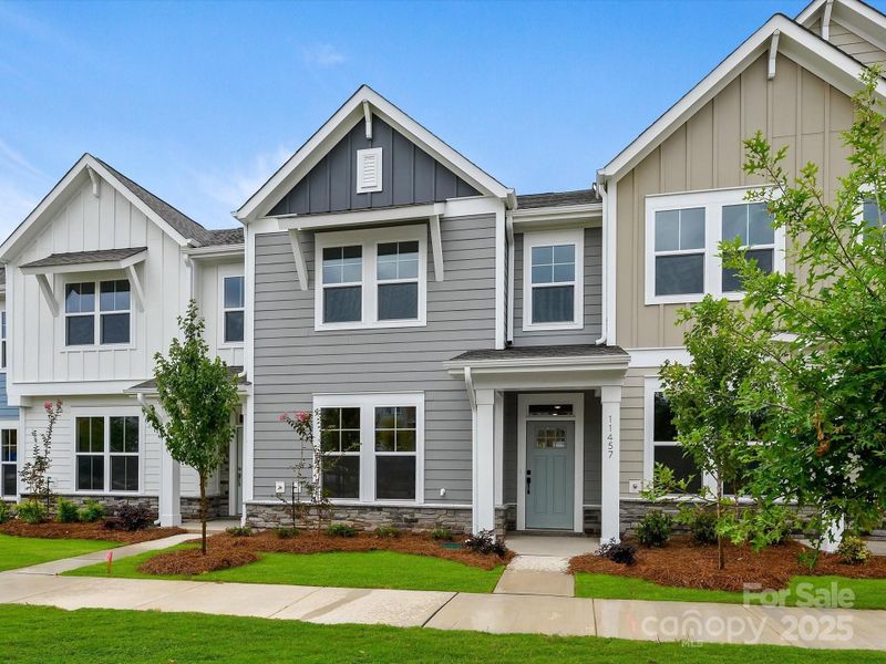 Front exterior of a new home in North Creek Village - Townhomes, Huntersville, NC, highlighting curb appeal (Image 19).