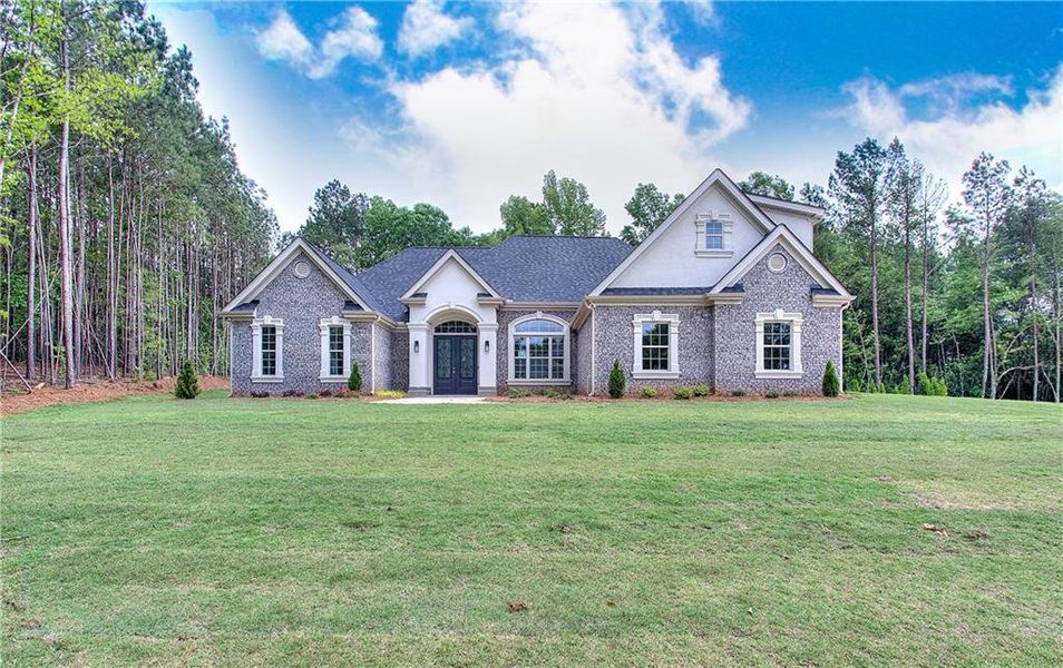 Front exterior of a new home in , Conyers, GA, highlighting curb appeal (Image 28). Front exterior of a new home in , Conyers, GA, highlighting curb appeal (Image 28).