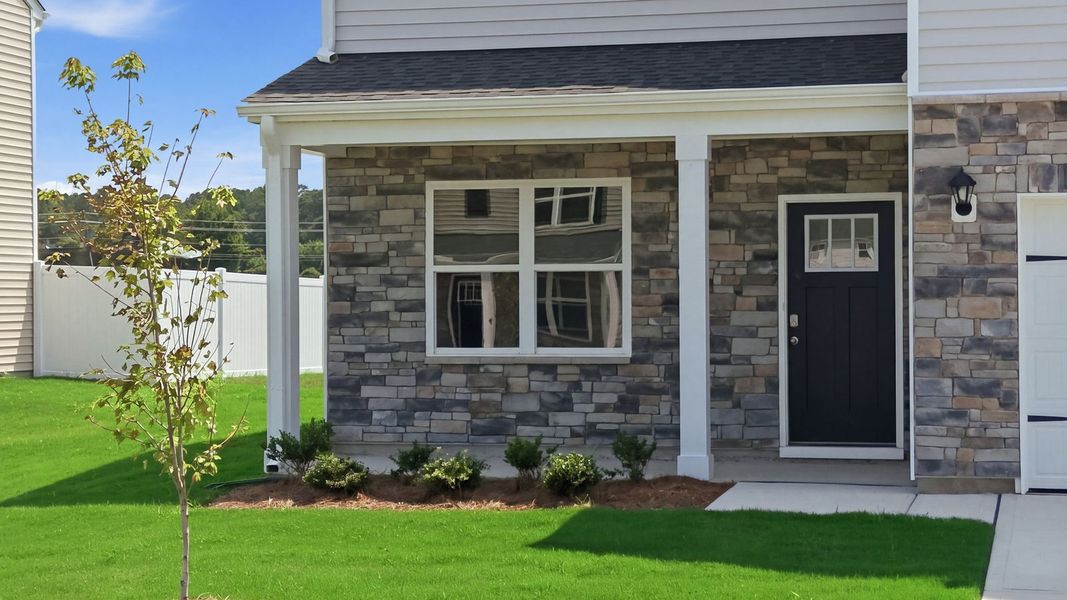 Exterior details and patio area of a home in East Ridge, Ayden (Image 3).