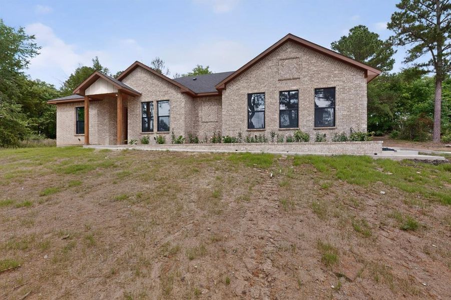 Front exterior of a new home in , Athens, TX, highlighting curb appeal (Image 2). Front exterior of a new home in , Athens, TX, highlighting curb appeal (Image 2).