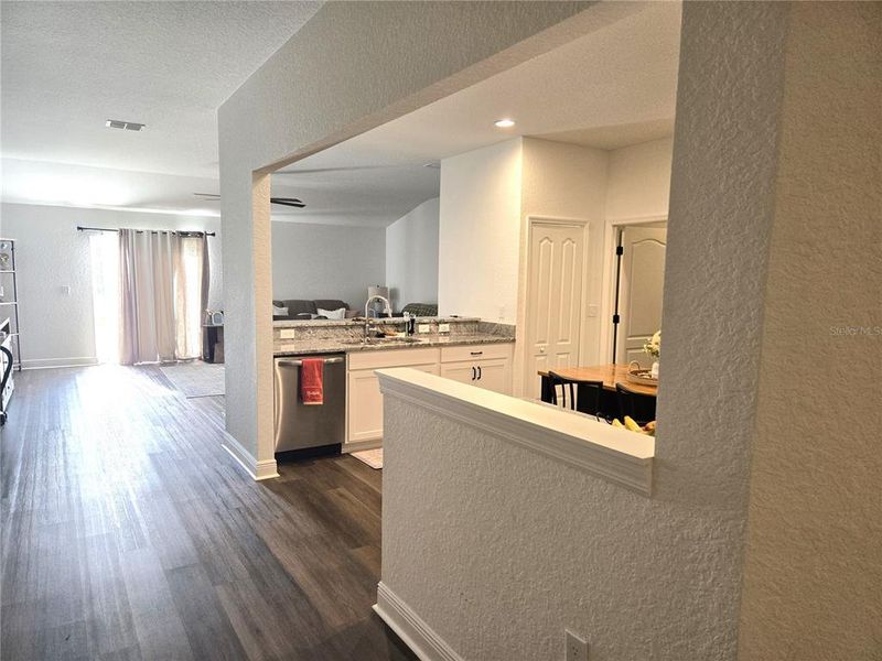 Open hallway to kitchen and living room