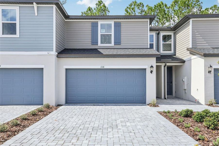 Front exterior of a new home in Bradford Park, Ormond Beach, FL, highlighting curb appeal (Image 19).