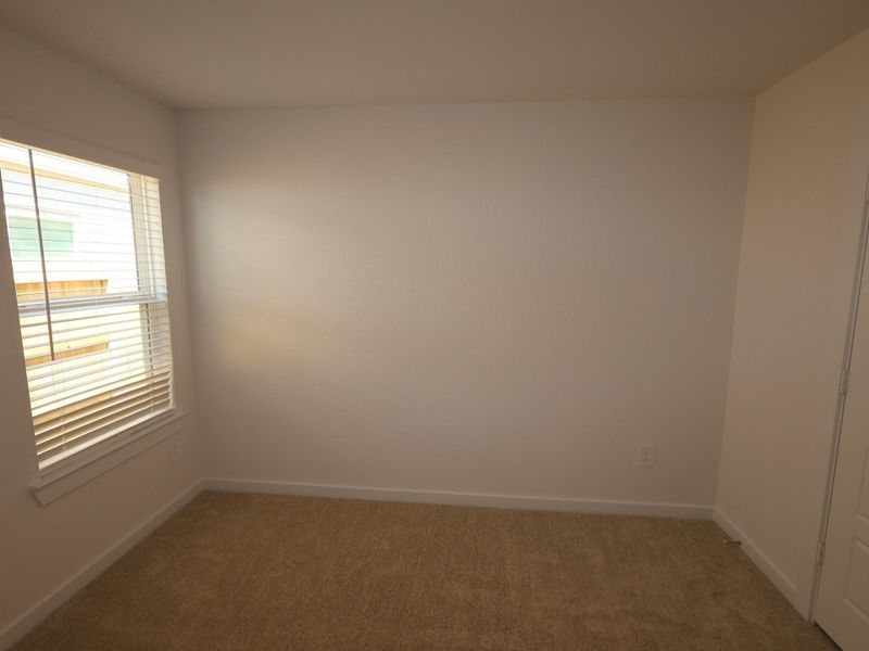 Spacious, unfurnished interior of a new home in Pinewood at Grand Texas, New Caney (Image 20).