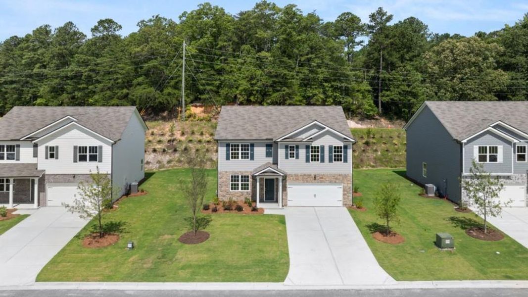 Front exterior of a new home in Northwoods at Mirror Lake, Villa Rica, GA, highlighting curb appeal (Image 2).
