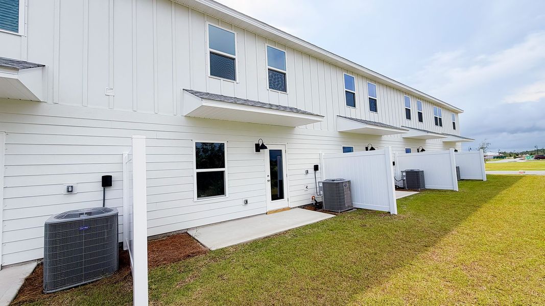 Exterior details and patio area of a home in Salt Creek Townhomes at Mexico Beach, Mexico Beach (Image 4).