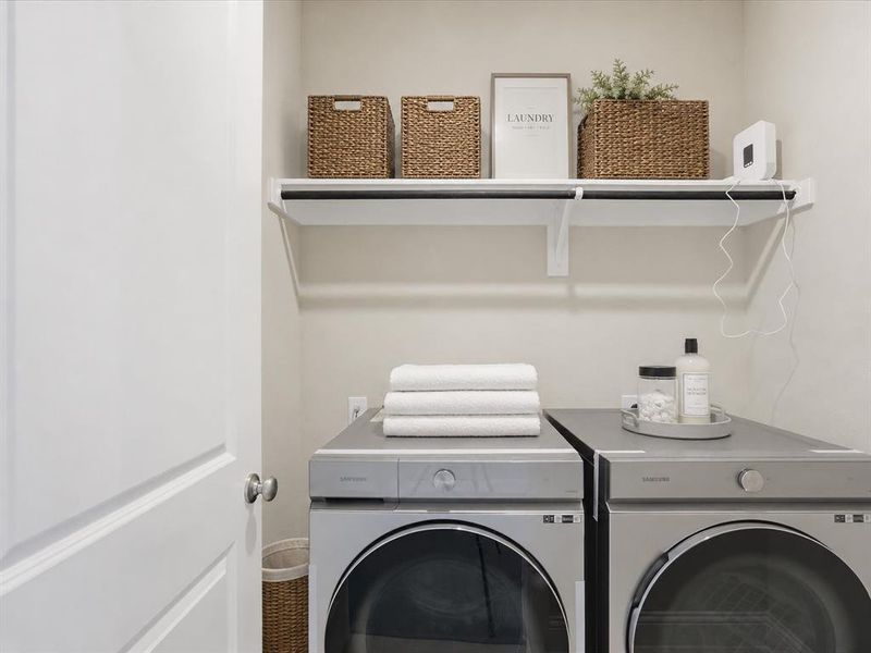 Dedicated laundry space featuring a white shelf with hanging rod Dedicated laundry space featuring a white shelf with hanging rod