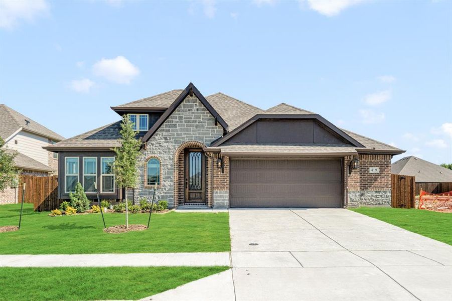 Front exterior of a new home in Maplewood, Glenn Heights, TX, highlighting curb appeal (Image 2).