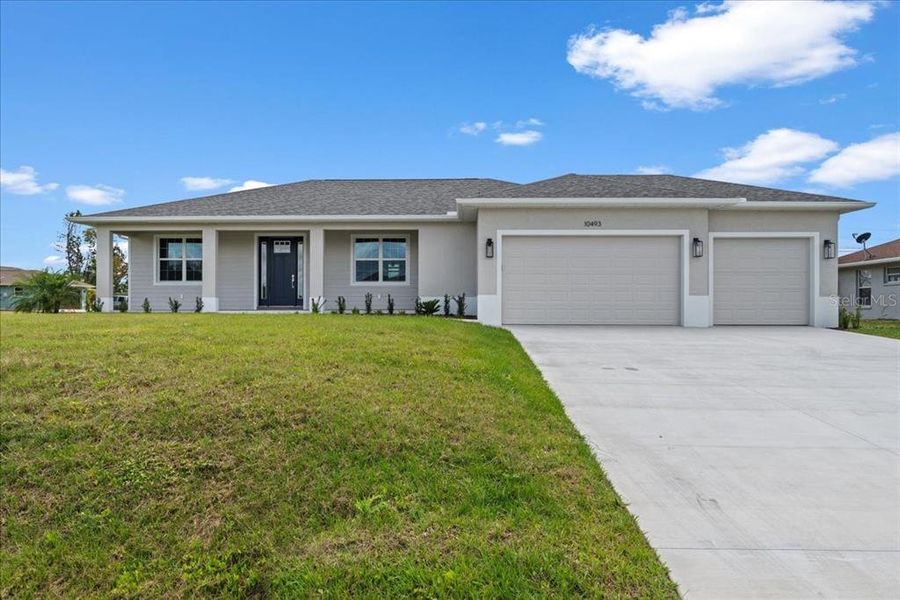 Front exterior of a new home in , Englewood, FL, highlighting curb appeal (Image 20). Front exterior of a new home in , Englewood, FL, highlighting curb appeal (Image 20).