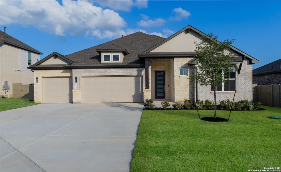 Front exterior of a new home in The Grove at Vintage Oaks, New Braunfels, TX, highlighting curb appeal (Image 19).