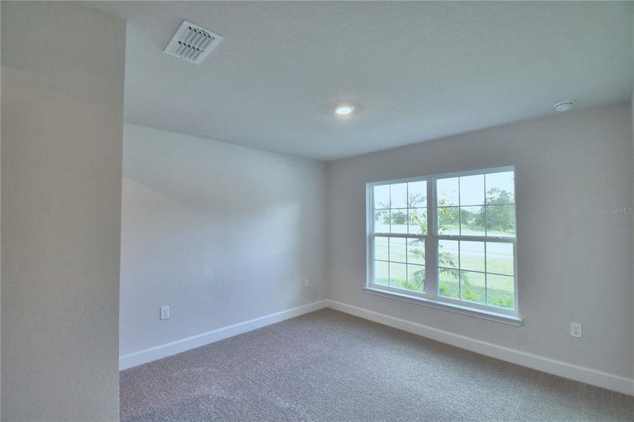 Spacious, unfurnished interior of a new home in Cadence Crossing, Auburndale (Image 20).