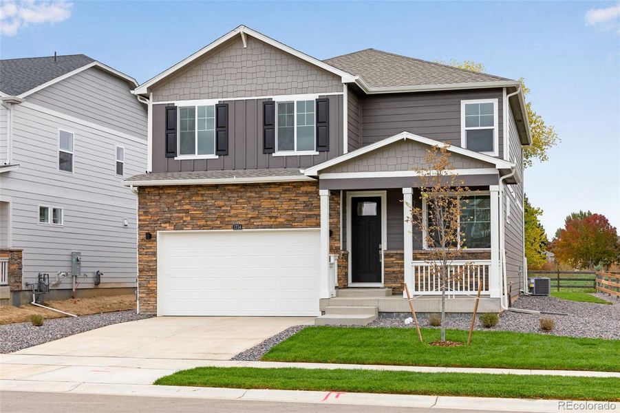 Front exterior of a new home in Hansen Farm, Fort Collins, CO, highlighting curb appeal (Image 2).