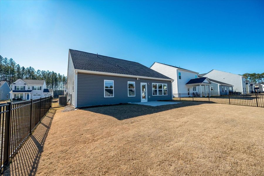 Exterior details and patio area of a home in , Ravenel (Image 24).