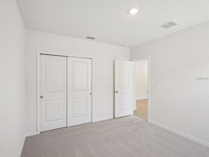 Spacious, unfurnished interior of a new home in The Grove at Stuart Crossing - Classic Series, Bartow (Image 14). Spacious, unfurnished interior of a new home in The Grove at Stuart Crossing - Classic Series, Bartow (Image 14).