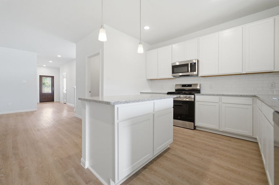 Furnished interior view inside a new home in The Pines at Seven Coves, Willis (Image 11).