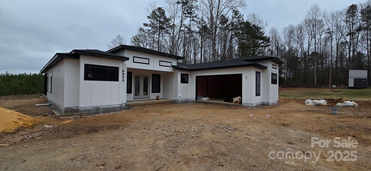 Front exterior of a new home in , Gastonia, NC, highlighting curb appeal (Image 9).