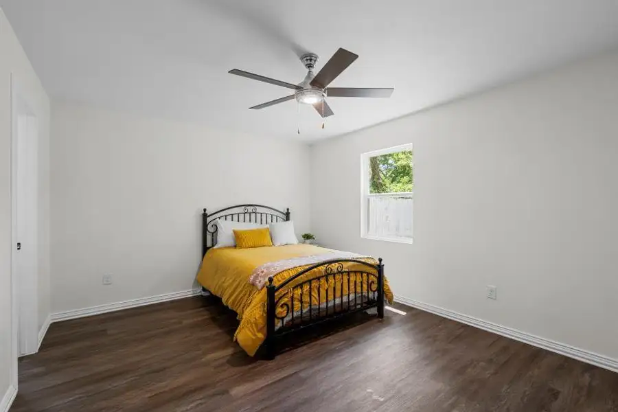 Bedroom featuring wood finished floors and a ceiling fan Bedroom featuring wood finished floors and a ceiling fan