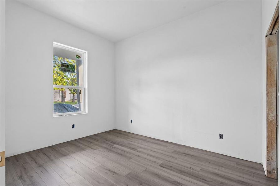 Spare room with wood finished floors Spare room with wood finished floors