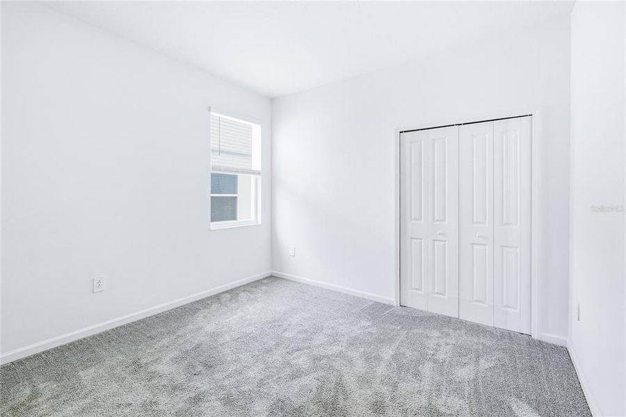 Spacious, unfurnished interior of a new home in Peace Creek Reserve, Winter Haven (Image 18).