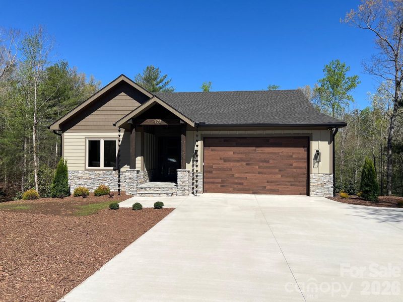 This beautiful home was carefully constructed using premium materials both inside and out. The exterior of the home is JamesHardie Fiber Cement Siding with natural stone veneer features which blend into the natural setting.The roofing material used is a GAF Timberline HDZ architectural shingle roof with a 25 year warranty. This beautiful home was carefully constructed using premium materials both inside and out. The exterior of the home is JamesHardie Fiber Cement Siding with natural stone veneer features which blend into the natural setting.The roofing material used is a GAF Timberline HDZ architectural shingle roof with a 25 year warranty.