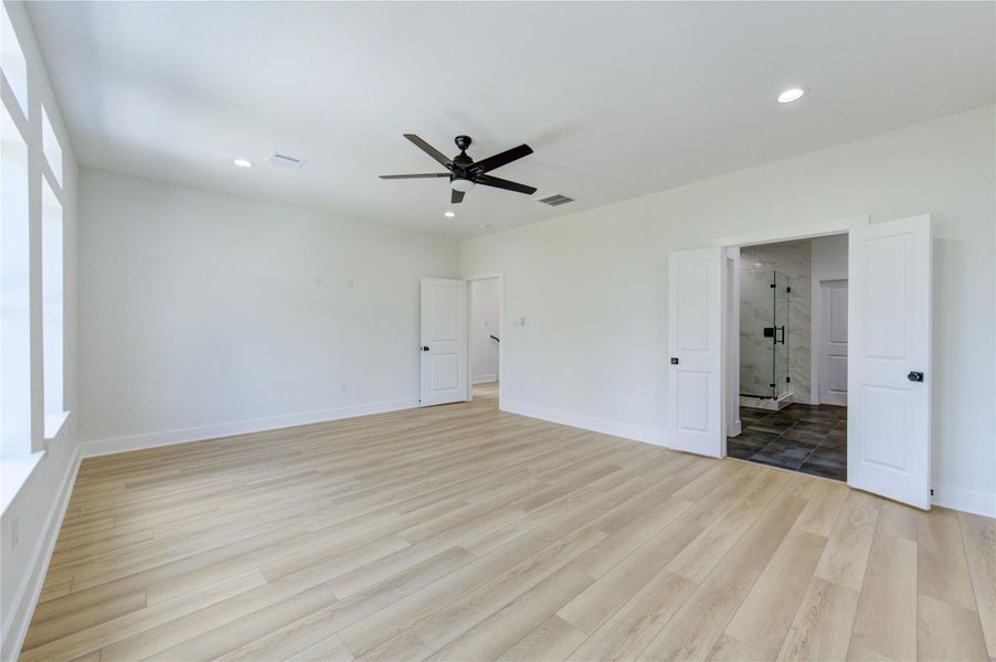 Another view of the primary bedroom