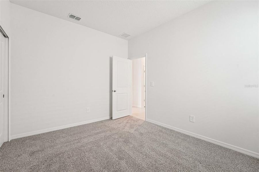 Spacious, unfurnished interior of a new home in The Grove at Stuart Crossing - Premier Series, Bartow (Image 14). Spacious, unfurnished interior of a new home in The Grove at Stuart Crossing - Premier Series, Bartow (Image 14).