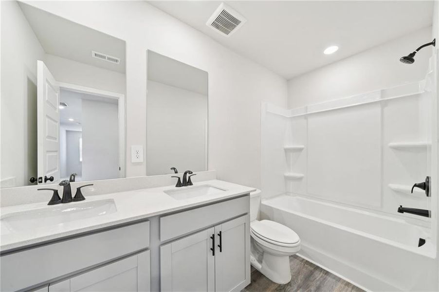 Furnished interior view inside a new home in Vines at Mill Creek - Estate Series, Braselton (Image 3).