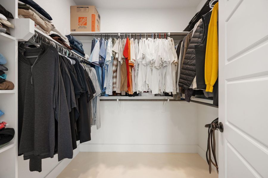 Ample hanging space and shelving offer exceptional organization within this well-appointed walk-in closet. Ample hanging space and shelving offer exceptional organization within this well-appointed walk-in closet.