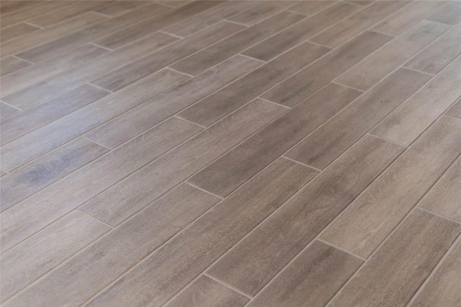 Hill House Natural tile flooring throughout the main living areas.