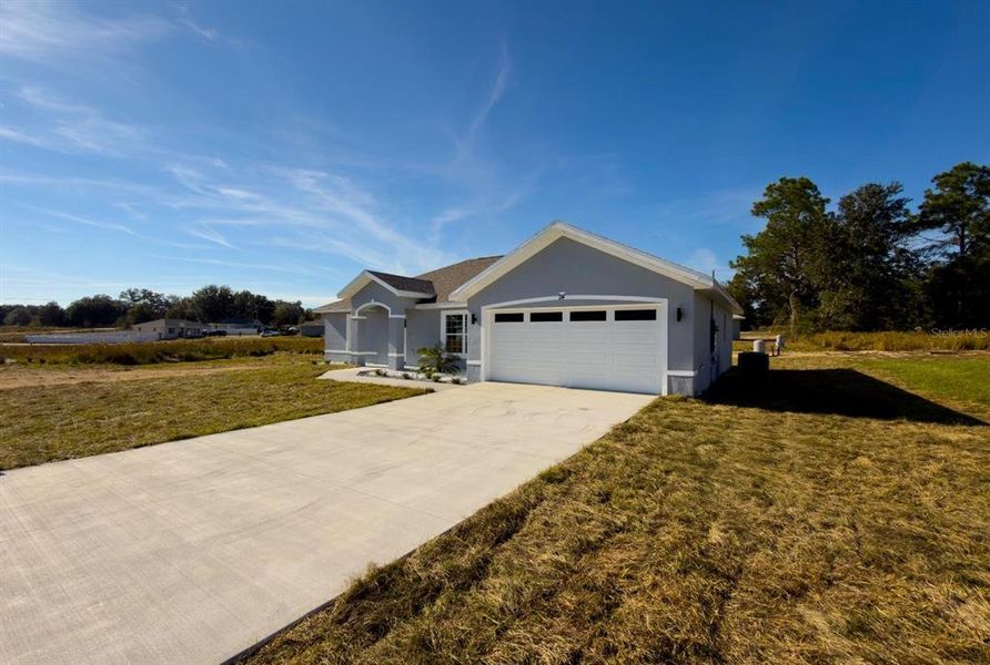 Front exterior of a new home in , Ocala, FL, highlighting curb appeal (Image 18).