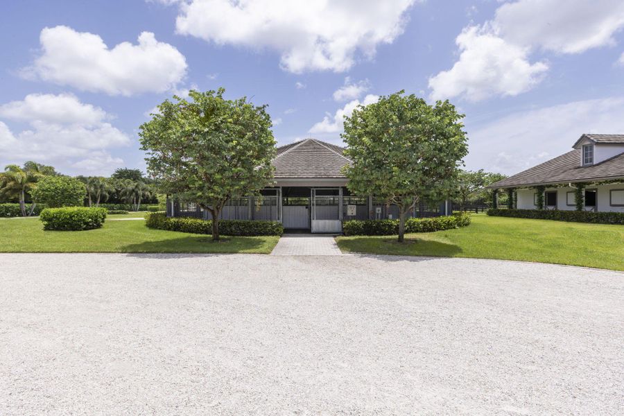 Front exterior of a new home in , Wellington, FL, highlighting curb appeal (Image 32). Front exterior of a new home in , Wellington, FL, highlighting curb appeal (Image 32).