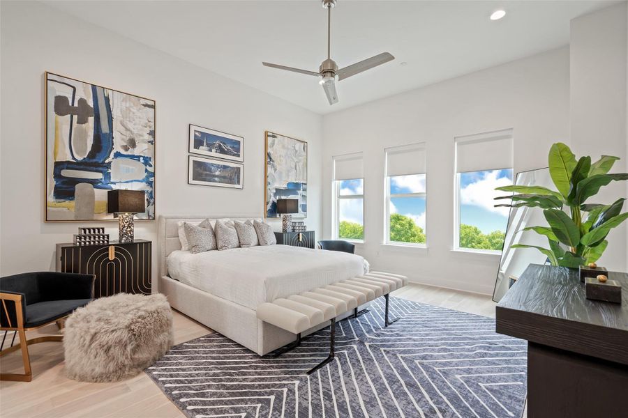Bedroom featuring wood finished floors and ceiling fan