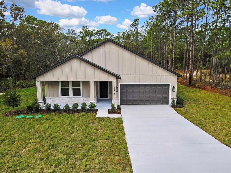 Front exterior of a new home in , Weeki Wachee, FL, highlighting curb appeal (Image 29).