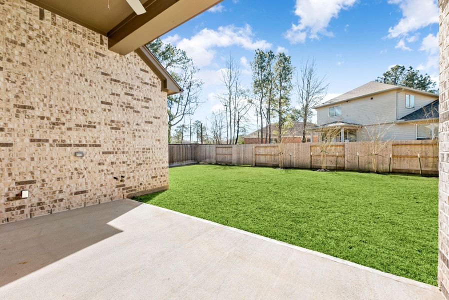 Exterior details and patio area of a home in Stewart’s Forest, Conroe (Image 4).