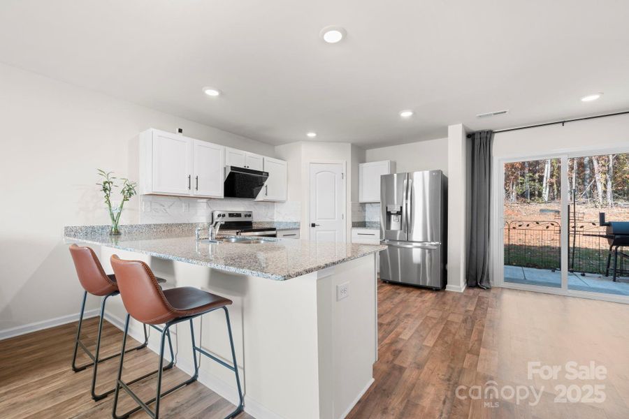 Furnished interior view inside a new home in , Lenoir (Image 12).
