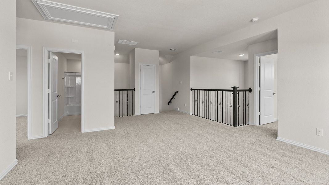 Representative furnished interior of a home built from the Southfork by Brightland Homes in Sunterra, Katy (Image 13).