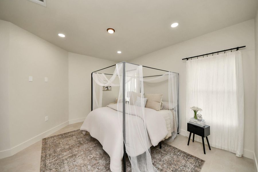 Lots of natural light in the primary suite, offering a bright and airy ambiance.