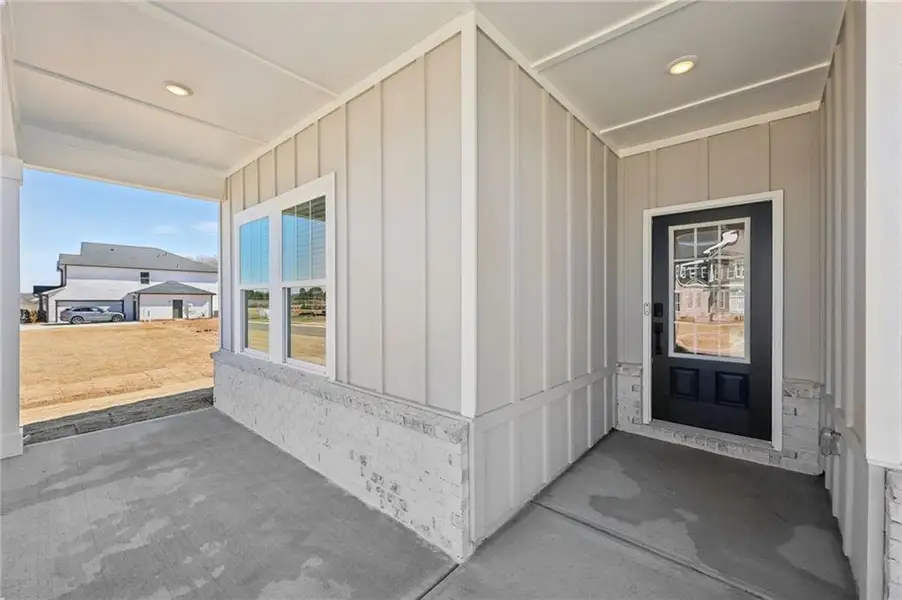 Exterior details and patio area of a home in River Pointe, Monroe (Image 3).