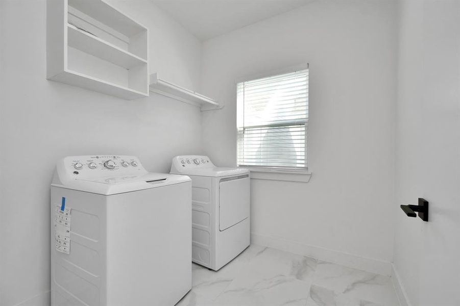 Spacious dedicated laundry area with plenty of room for large washer and dryer, ensuring that even the everyday household chores are completed in elegance with ease and efficiency