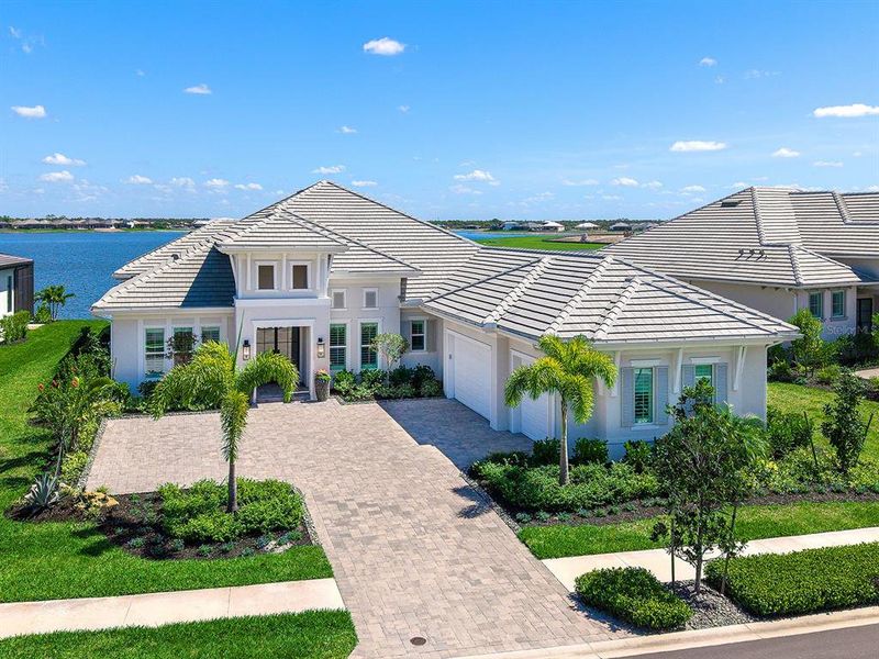 Front exterior of a new home in , Sarasota, FL, highlighting curb appeal (Image 24).