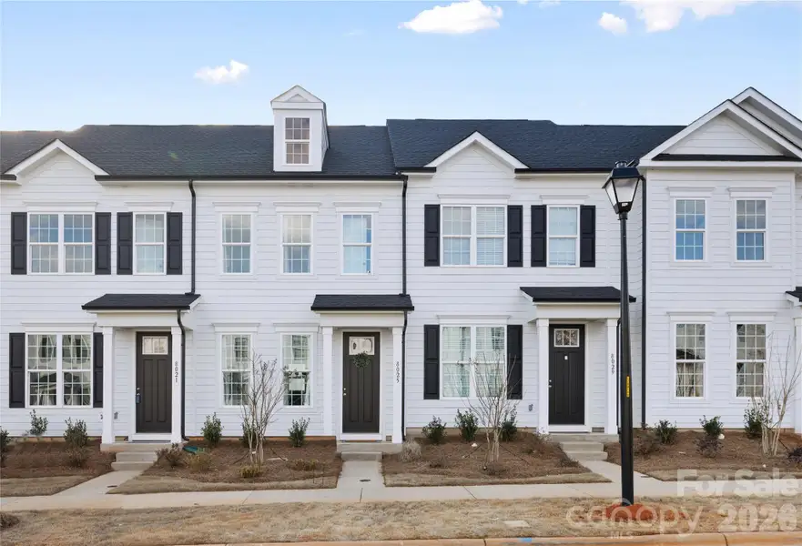 Front exterior of a new home in Edgewood Preserve, Huntersville, NC, highlighting curb appeal (Image 1). Front exterior of a new home in Edgewood Preserve, Huntersville, NC, highlighting curb appeal (Image 1).