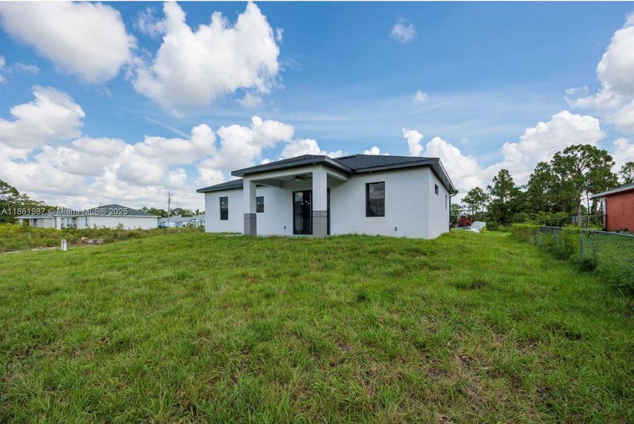 Front exterior of a new home in , Lehigh Acres, FL, highlighting curb appeal (Image 23). Front exterior of a new home in , Lehigh Acres, FL, highlighting curb appeal (Image 23).