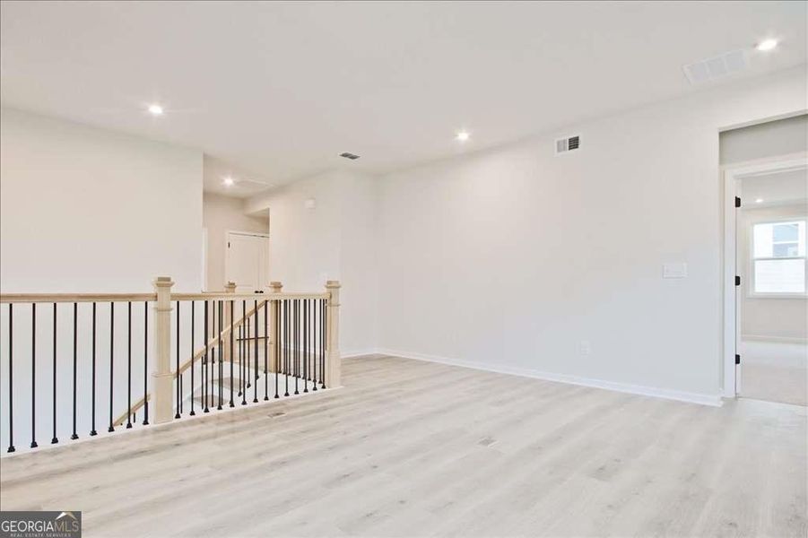 Spacious, unfurnished interior of a new home in The Paddocks at Doc Hughes, Buford (Image 45).