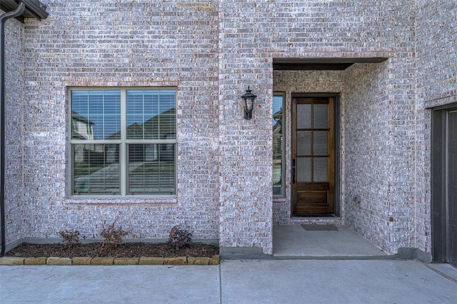 Exterior details and patio area of a home in Estates at Baker Park, Sherman (Image 3).