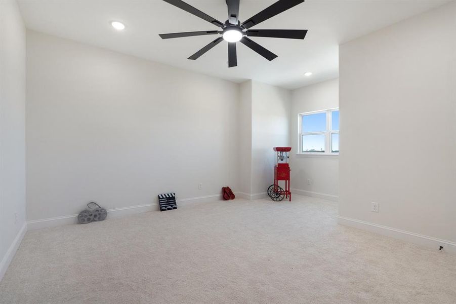 Unfurnished room with light carpet, recessed lighting, and a ceiling fan Unfurnished room with light carpet, recessed lighting, and a ceiling fan