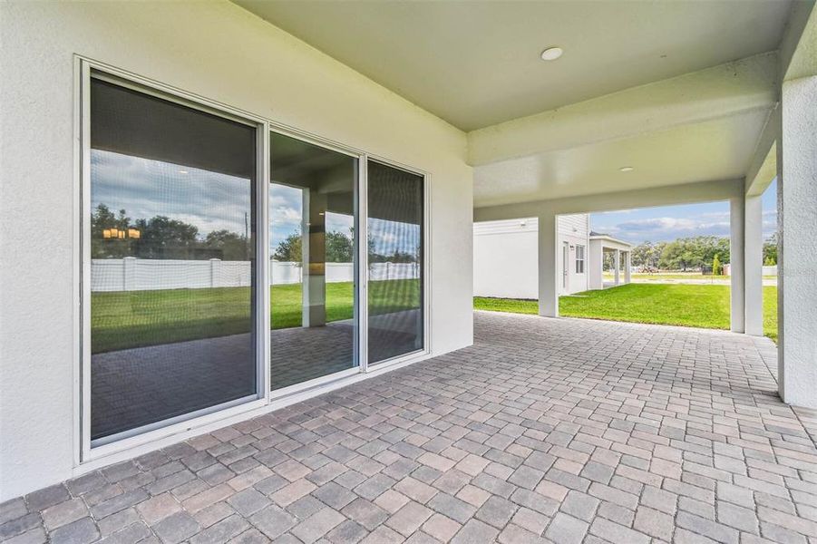 Exterior details and patio area of a home in Solace at Corner Lake, Orlando (Image 37).