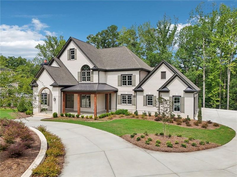 Front exterior of a new home in The Reserve At Governors Towne Club, Acworth, GA, highlighting curb appeal (Image 26). Front exterior of a new home in The Reserve At Governors Towne Club, Acworth, GA, highlighting curb appeal (Image 26).