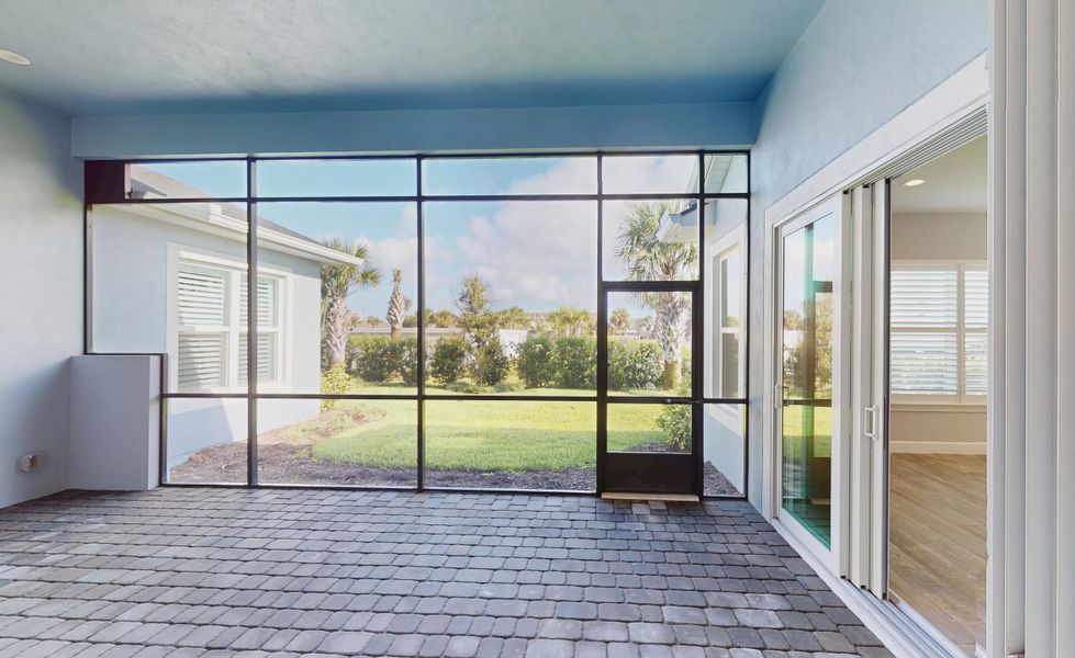 Exterior details and patio area of a home in Verona Oceanside, Ormond Beach (Image 25).